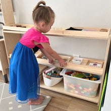 Load image into Gallery viewer, Child playing with toys on a wooden shelf in a home setting