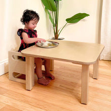 Load image into Gallery viewer, Child sitting at a small wooden table with a chair, playing with a toy.