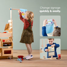 Load image into Gallery viewer, Child interacting with a educational toy setup in a playroom.