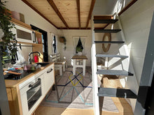 Load image into Gallery viewer, 2-Story Black and White Playhouse Prince inside view with kids  kitchen set and furniture set and a wooden ladder to upper floor by WholeWoodPlayhouses