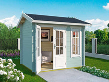 Load image into Gallery viewer, DIY Kit 8x7 Solo Hub playhouse in a soft pastel green with white accents, providing a cozy and customizable space for hobbies and relaxation by WholeWoodPlayhouses