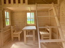 Load image into Gallery viewer, Wooden playhouse inside view with a ladder, table, and chairs by WholeWoodPlayhouses