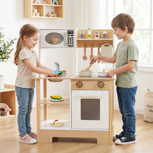 Load image into Gallery viewer, Two children playing with a wooden kitchen set in a bright room.