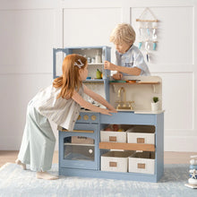 Load image into Gallery viewer, Two children playing with a blue toy kitchen set in a room.