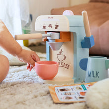 Load image into Gallery viewer, Children's toy coffee machine with a pink cup on a carpeted floor.