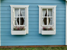 Load image into Gallery viewer, Two window and two flower boxes with plants on a blue wooden wall by WholeWoodPlayhouses