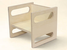 Load image into Gallery viewer, Wooden stool with cut-out design on a beige background