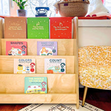 Load image into Gallery viewer, Wooden bookshelf with children's educational books in a room setting.