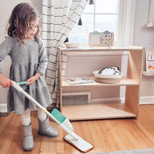 Load image into Gallery viewer, Child using a mop in a room with a wooden floor and striped curtains.