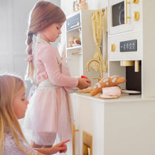 Load image into Gallery viewer, Two young girls playing with a toy kitchen set.