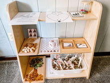 Load image into Gallery viewer, Wooden Shelf set with various play items on a tiled floor.