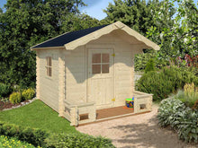 Load image into Gallery viewer, Kids Wooden Playhouse DIY Kit Little Chalet in natural color with black roof and little porch in the backyard by WholeWoodPlayhouses