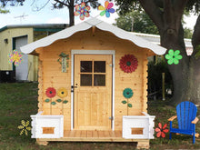 Load image into Gallery viewer, Front outside view of assembled wooden kids playhouse DIY Kit Little Cabin with decorations | outdoor playhouse DIY kit by WholeWoodPlayhouses
