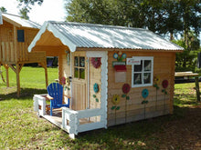Load image into Gallery viewer, Front right-side view of assembled wooden kids playhouse DIY Kit Little Cabin with decorations | outdoor playhouse DIY kit by WholeWoodPlayhouses