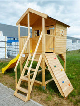 Load image into Gallery viewer, Outside of outdoor playhouse DIY kit Little Tower with a slide and climbing wall by WholeWoodPlayhouses