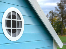 Load image into Gallery viewer, Close Up of the Round Top Window of Kids Outdoor Playhouse Bluebird, Blue Wall and White Window Trim by WholeWoodPlayhouses