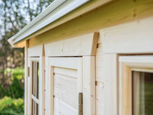 Load image into Gallery viewer, Close up of the Window and Door Wooden Moldings of Kids Playhouse Natural Wonder by WholeWoodPlayhouses