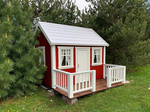 Red Wooden Playhouse Nordic Nario with white roof, wooden terrace and white railing on the backyard by WholeWoodPlayhouses