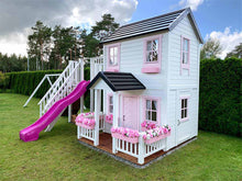 Load image into Gallery viewer, 2- story white Wooden Playhouse Princess with pink fishbone door, pink window trims and pink flower boxes on green lawn by WholeWoodPlayhouses