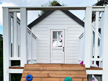 Load image into Gallery viewer, 2-Story wooden playhouse Princess close up of the balcony and kids size white door with pink trims and window by WholeWoodPlayhouses