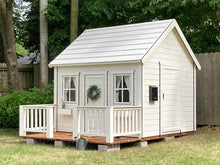 Load image into Gallery viewer, Kids Playhouse Snowy Owl with black trims, wooden terrace  and flower boxes in the garden by WholeWoodPlayhouses