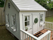 Load image into Gallery viewer, Close up of the round top window  and front side of Kids Outdoor Playhouse Snowy Owl by WholeWoodPlayhouses