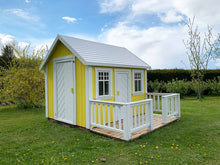 Load image into Gallery viewer, Yellow Wooden Playhouse Sunshine with white door on green lawn in a backyard by WholeWoodPlayhouses