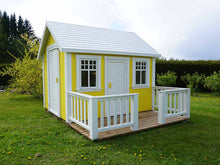 Load image into Gallery viewer, Yellow Wooden Playhouse Sunshine with white door and terrace on green lawn in a backyard by WholeWoodPlayhouses