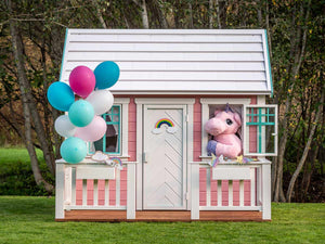 Front outside view of pink Kids Playhouse Unicorn by WholeWoodPlayhouses