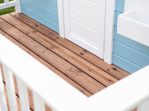 Close Up Of wooden terrace with white railings Of Kids Wooden Playhouse Bluebird By WholeWoodPlayhouses
