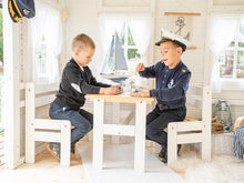 Load image into Gallery viewer, Boys playing on the kids furniture of the Wooden Playhouse Bluebird with marine theme decorations by WholeWoodPlayhouses 
