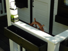 Load image into Gallery viewer, 2-Story Wooden Playhouse Prince close up of the wooden porch with white railing with black flower boxes and steering wheel by WholeWoodPlayhouses