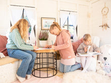 Load image into Gallery viewer, Kids draw and read in the black and white wooden playhouseby WholeWoodPlayhouses