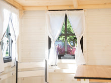 Load image into Gallery viewer, Inside of Outdoor Playhouse Blackbird close up of opening safety glass window with curtains by WholeWoodPlayhouses
