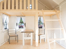 Load image into Gallery viewer, Inside of a Wooden Playhouse with loft, round top window, ladder and kids furniture set by WholeWoodPlayhouses