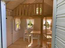 Load image into Gallery viewer, Interior view of a white wooden playhouse Snowy Owl with ladder to loft and kids chair, bench, table by WholeWoodPlayhouses