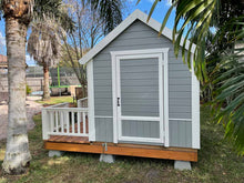 Load image into Gallery viewer, Close Up Of the side gray door with white trims Of Outdoor Playhouse Boy Cave by WholeWoodPlayhouses

