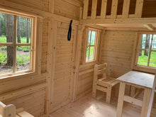 Load image into Gallery viewer, Inside of a wooden playhouse with loft and kids furniture by WholeWoodPlayhouses
