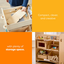Load image into Gallery viewer, Wooden play kitchen set with storage space, labeled 'Compact, clever, and creative with plenty of storage space.'
