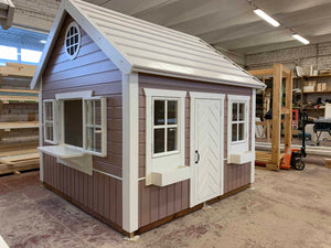 Handcrafted playhouse with added shop window, perfect for imaginative play and realistic roleplay.