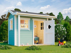 Outside of blue DIY wooden kids playhouse Little Lodge with a small porch and toys | DIY kids playhouse kits by WholeWoodPlayhouses