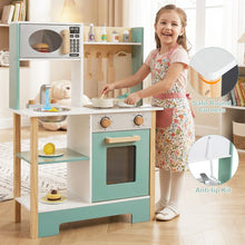 Load image into Gallery viewer, Child playing with a toy kitchen set in a room with books and a teddy bear.
