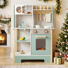 Load image into Gallery viewer, Children's play kitchen set in a festive room with Christmas decorations.
