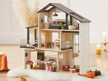 Load image into Gallery viewer, Black and white dollhouse with furniture and dolls
