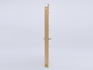 Side profile of wooden playhouse door with visible metal handle and assembly bolts, ready for installation