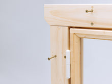 Load image into Gallery viewer, Close-up of wooden playhouse window frame with white hinge and visible installation screws
