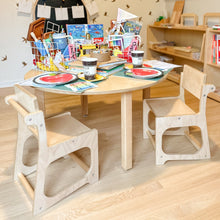 Load image into Gallery viewer, Children's table and chairs set with art supplies in a classroom setting
