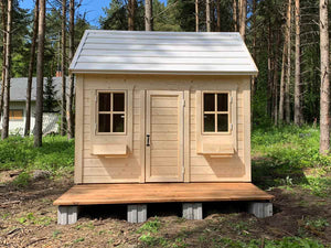 Front outside view of Kids Playhouse Natural Wonder with forest on the background by WholeWoodPlayhouses