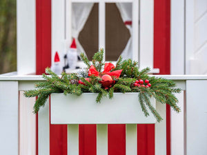 Close up of the wooden flower box with cristmas decoration of Kids Playhouse Nordic Nario by WholeWoodPlayhouses
