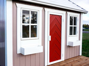 Close up of the front windows and door of Wooden Playhouse Plum by WholeWoodPlayhouses